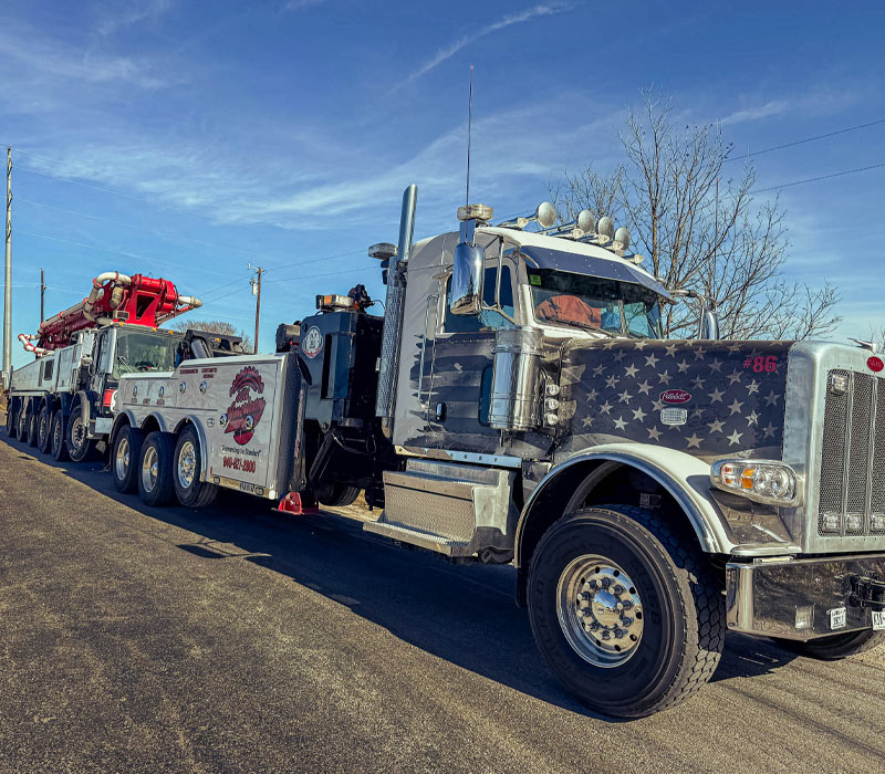 Heavy-Duty-Tow-Truck-Towing-a-Concrete-Pumper-Truck-Justin-Texas Heavy Duty Tow Truck Towing a Concrete Pumper Truck Justin Texas