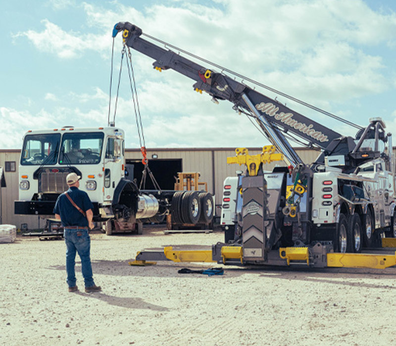 Tow-Truck-Operator-Remotely-Controlling-a-Rotator-Justin-Texas-All-American-Towing Tow Truck operator remotely controlling a rotator in Justin Texas All American Towing